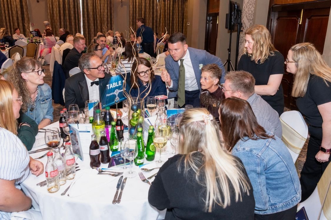Close-up magic at the table during a corporate dinner